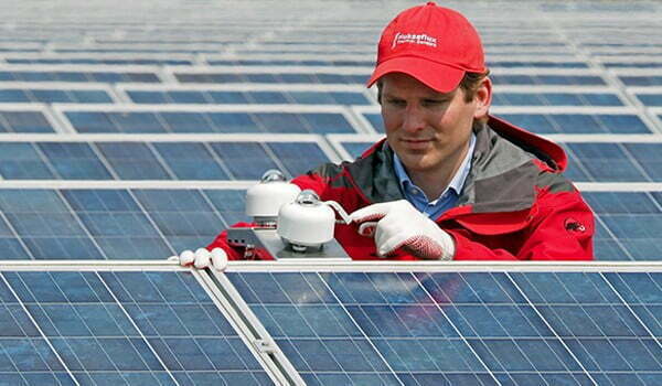 Worker checking solar radiometers