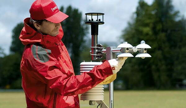 Worker checking solar radiometers